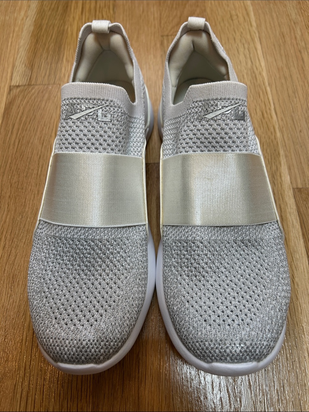 APL Women’s Slip-On Sneakers in Light Gray and White